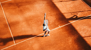 Tennis player serving